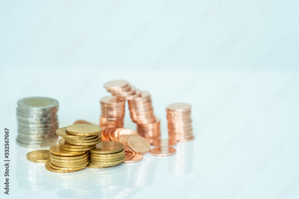 Miniature people: Stack of coins with copy space for text using as background saving, investment, money, financial, business analytics concept. Miniature people: Stack of coins with copy space for text using as background saving, investment, money, financial, business analytics concept.