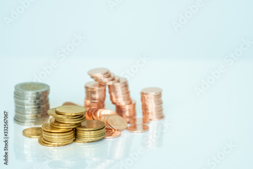 Miniature people: Stack of coins with copy space for text using as background saving, investment, money, financial, business analytics concept.