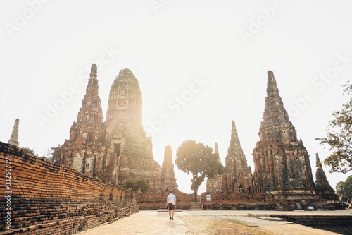 Traveler tourist man walking at Chaiwatthanaram temple of Ayutthaya in the Thailand. ayutthaya historical park, Ayutthaya, Thailand.