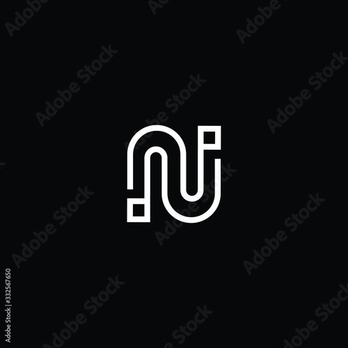 Minimal elegant monogram art logo. Outstanding professional awesome artistic Technology N NN NU UN initial based Alphabet icon logo. Premium Business Technology logo White color on black background