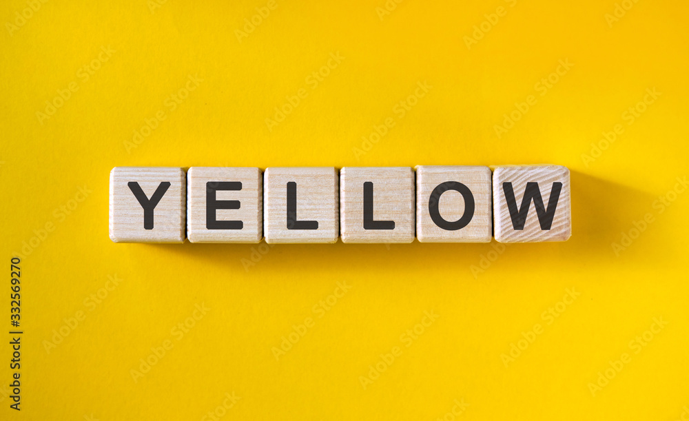YELLOW text on cubes on a yellow homogeneous background YELLOW text on cubes on a yellow homogeneous background