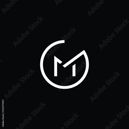 Minimal elegant monogram art logo. Outstanding professional trendy awesome artistic GM MG initial based Alphabet icon logo. Premium Business logo White color on black background photo