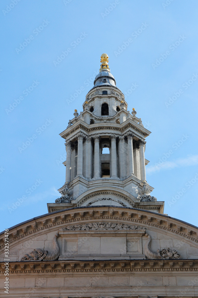 Top part of St Paul's Cathedral against blue clear sky, London, UK