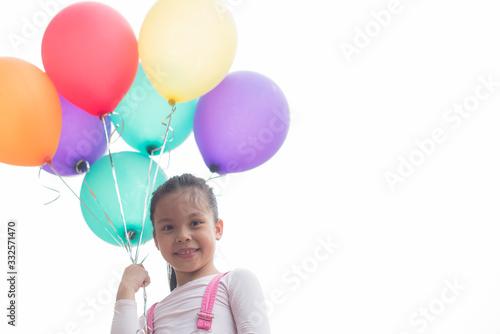 happy little asian girl child playing with colorful toy balloons outdoors. summer holidays, celebration, family, children and people-happy girl with colorful balloons. freedom and imagination concept.