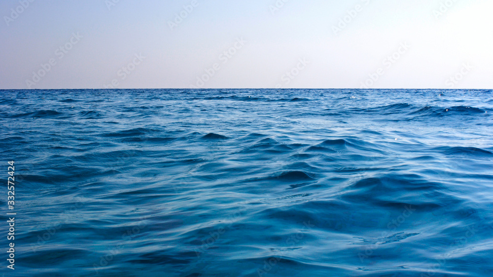 Fototapeta premium Blue waves on sea water surface