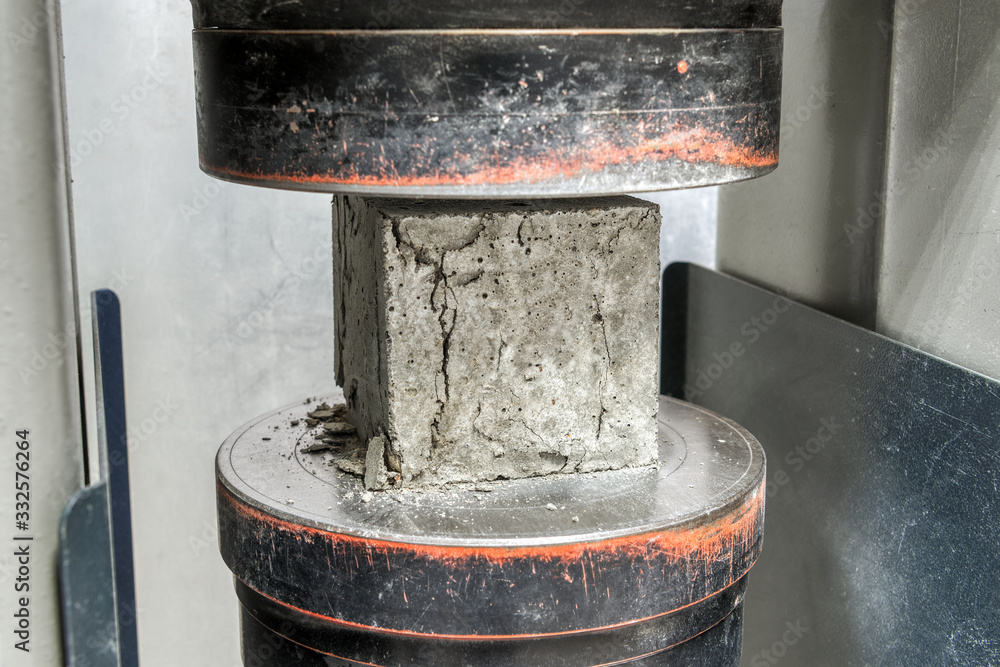 Concrete cube after a compressive strength test. The test sample cracked. - obrazy, fototapety, plakaty 