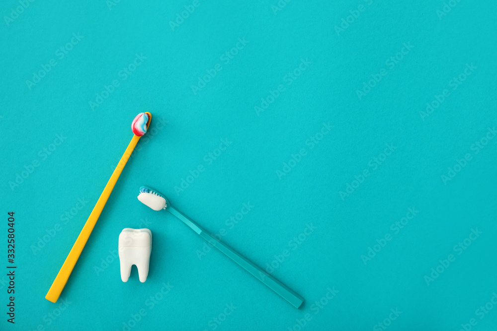 Tooth brushes with paste on color background Tooth brushes with paste on color background