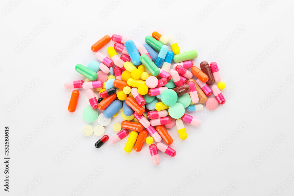 Heap of different pills on white background Heap of different pills on white background