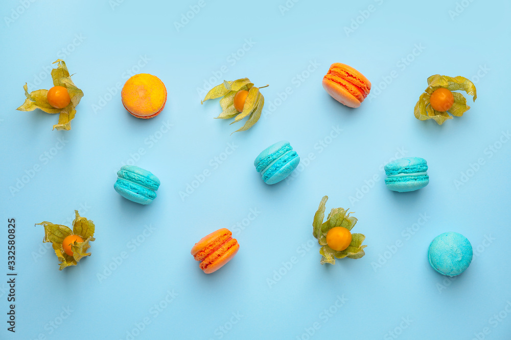 Tasty macarons with fruit on color background Tasty macarons with fruit on color background