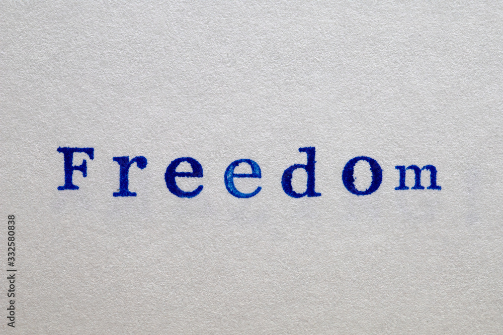 a freedom word stamped on a piece of paper. a freedom word stamped on a piece of paper.