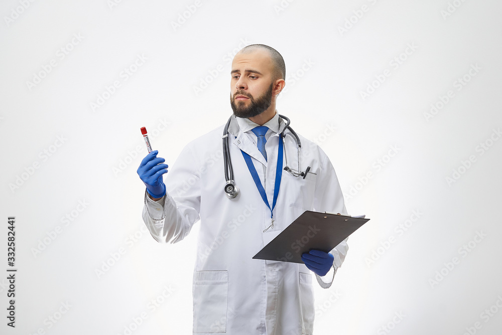 A doctor looking at a coronavirus blood test in his hand. A portrait of an infectious disease physician holding a positive COVID-19 blood sample and a clipboard. A doctor looking at a coronavirus blood test in his hand. A portrait of an infectious disease physician holding a positive COVID-19 blood sample and a clipboard.