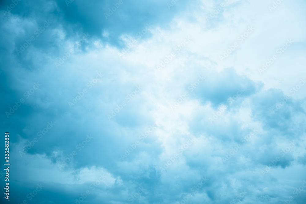 Fototapeta premium Blue sky with floating white clouds. The background.