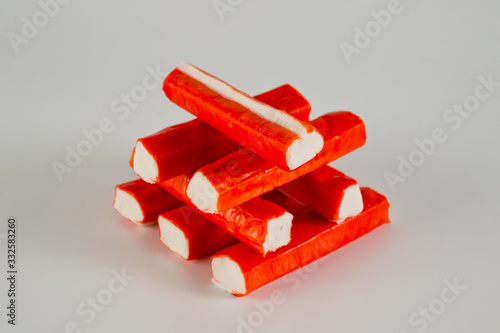 Frozen crab sticks shot on a light background. Background for food and ingredients. photo