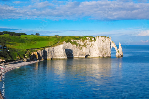 Beautiful cliffs Aval of Etretat, rocks and natural arch landmark of famous coastline, sea landscape of Normandy, France, Europe