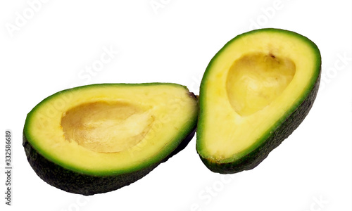 Two slices of avocado on a white background isolate