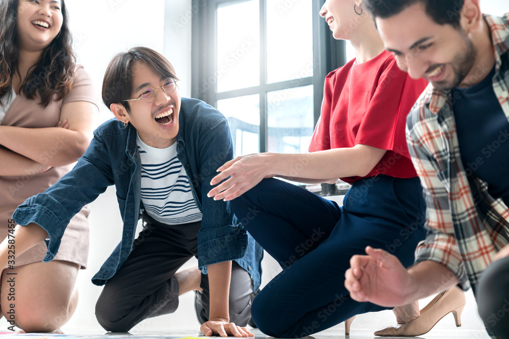 Group of asian and caucasian young creative happy enjoy laugh smile and great success emotion teamwork people business startup entrepreneur casual brainstorm business meeting office background Group of asian and caucasian young creative happy enjoy laugh smile and great success emotion teamwork people business startup entrepreneur casual brainstorm business meeting office background