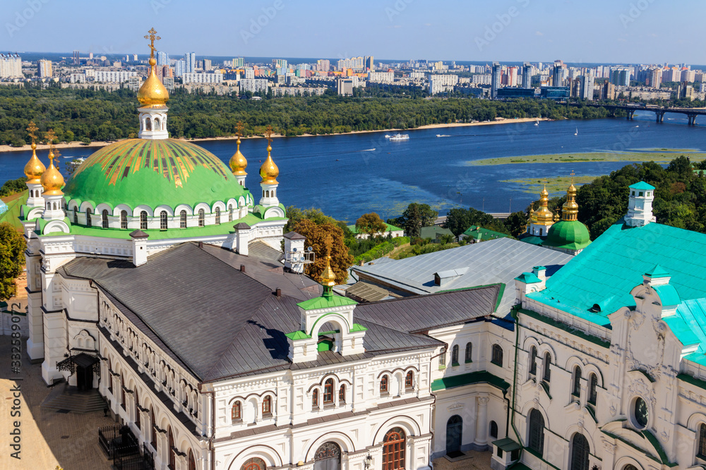 View of the refectory church of Kiev Pechersk Lavra (Kiev Monastery of the Caves) and the Dnieper river in Ukraine. View from Great Lavra Bell Tower