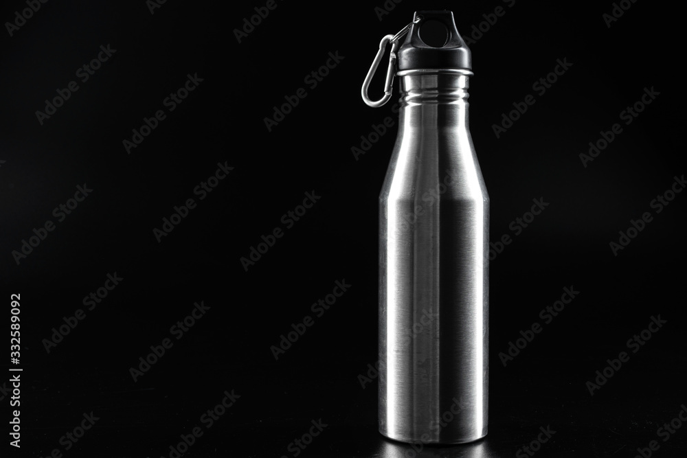 Sport bottle for drink on black background close up Sport bottle for drink on black background close up