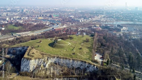 Krakus Mound in Krakow, Poland. Krakus was legendary founder of the town. The origin of the mound, probably early medieval kurgan, is not known. Old quarry in front. City panorama in the background
