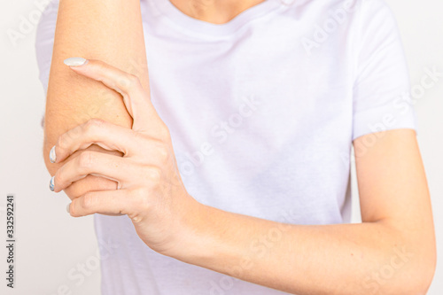 Wallpaper Mural Woman suffering from chronic joint rheumatism. Elbow pain and treatment concept Torontodigital.ca