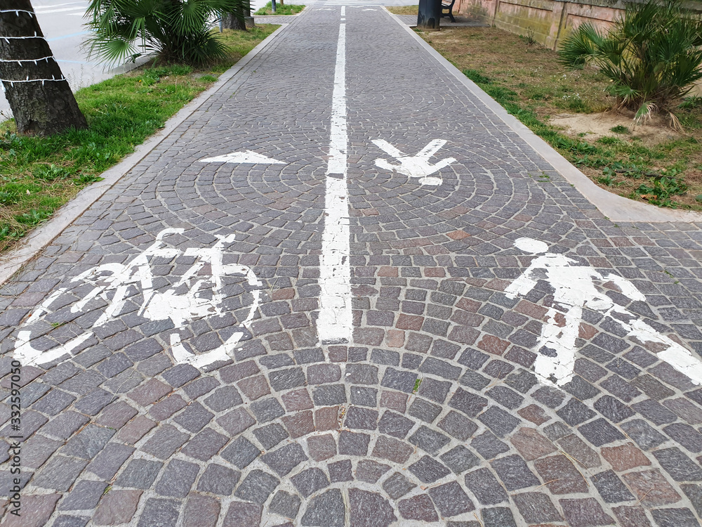 Road markings on the sidewalk for pedestrians and cyclists in Europe.