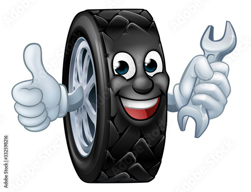 A tyre cartoon car mechanic service mascot holding a spanner and giving a thumbs up