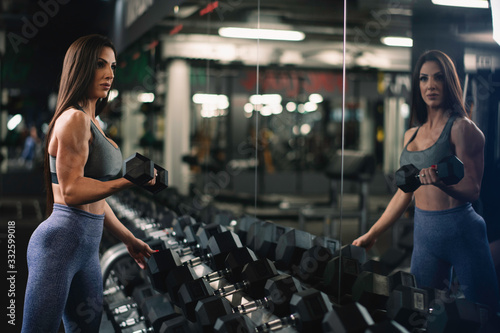 Fitness woman on training. Young woman in the gym.	