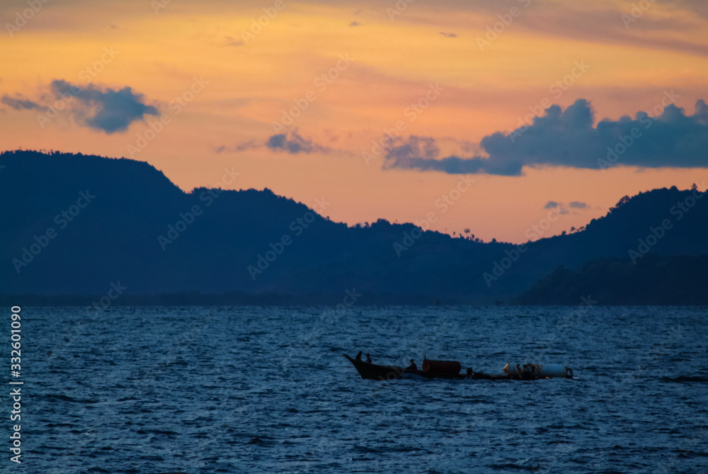 Sipadan Rowboat On Celebes Sea At Sunset