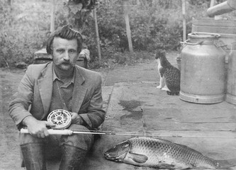 old vintage photo man with a fishing rod