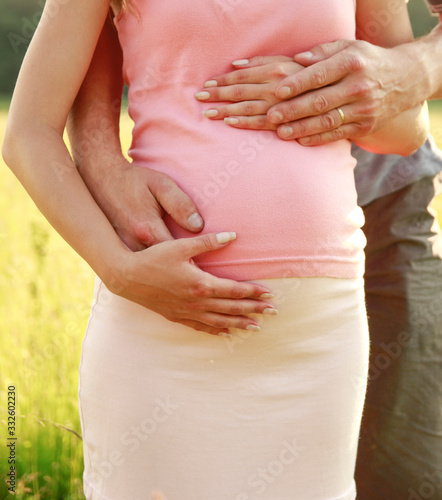 Wallpaper Mural Loving pregnant couple in nature Torontodigital.ca