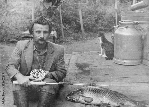 old vintage photo man with a fishing rod