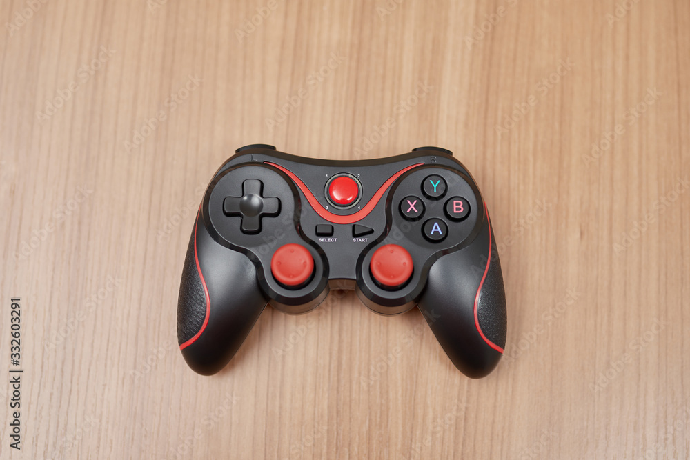 gamepad with a wooden background gamepad with a wooden background