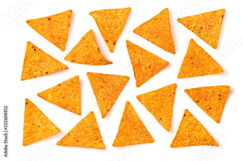 Nachos Mexican corn chips background. Delicious nachos snack, flat lay, isolated on white. Tortilla nacho crisps layout. Creative concept, top view.