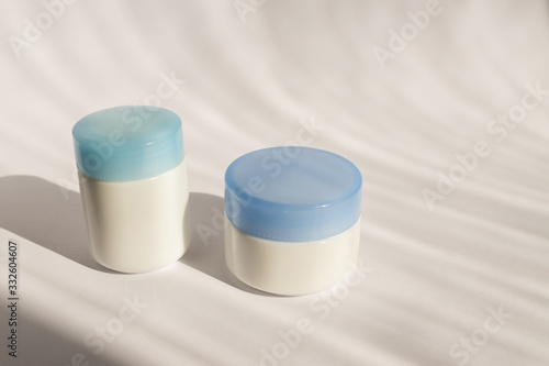 Cosmetic cream  two balm jar mockup on white background. Make up product blank container. Body and face care