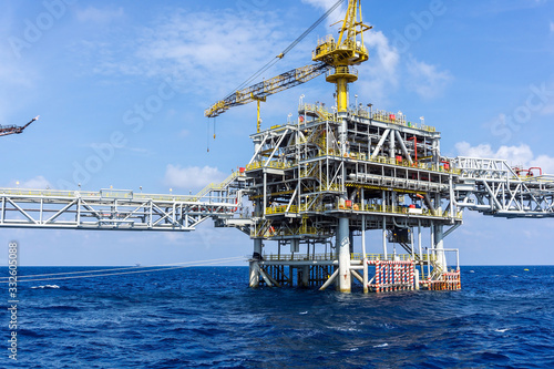 Offshore production platforms complex connected with bridges at oil field