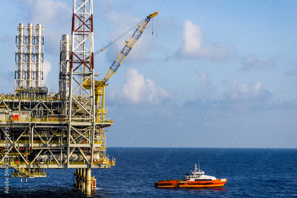A fast crew boat approaching by snatching method to an oil prodcutio platform at oil field