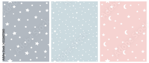 Tiny Stars Vector Patterns. Irregular Hand Drawn Simple Starry Sky Print for Fabric, Textile, Wrapping Paper. Infantile Style Galaxy Design. Little Stars Isolated on a Gray, Blue and Pastel Pink. 