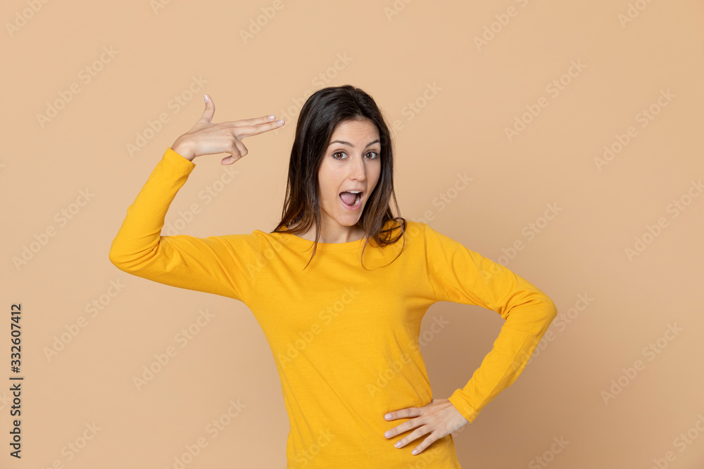 Attractive young girl wearing a yellow T-shirt Attractive young girl wearing a yellow T-shirt
