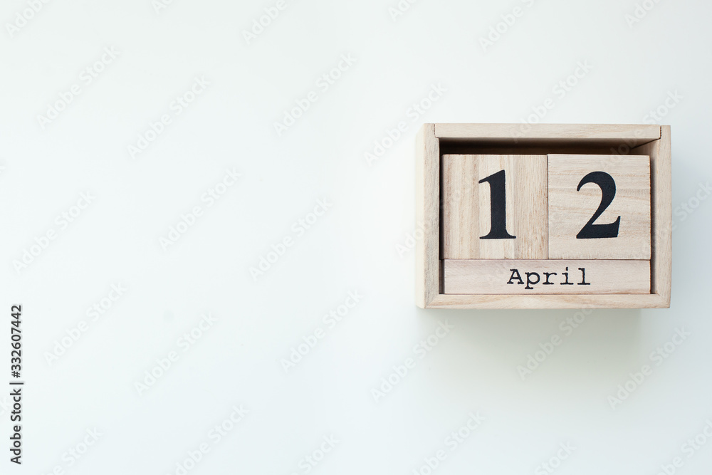 April 12 Easter Wooden block calendar on white isolated background. Easter. View from above with copy space. Catholic Easter. Rustic wooden decor home. Spring Easter Holiday Card. Top view. celebrate April 12 Easter Wooden block calendar on white isolated background. Easter. View from above with copy space. Catholic Easter. Rustic wooden decor home. Spring Easter Holiday Card. Top view. celebrate