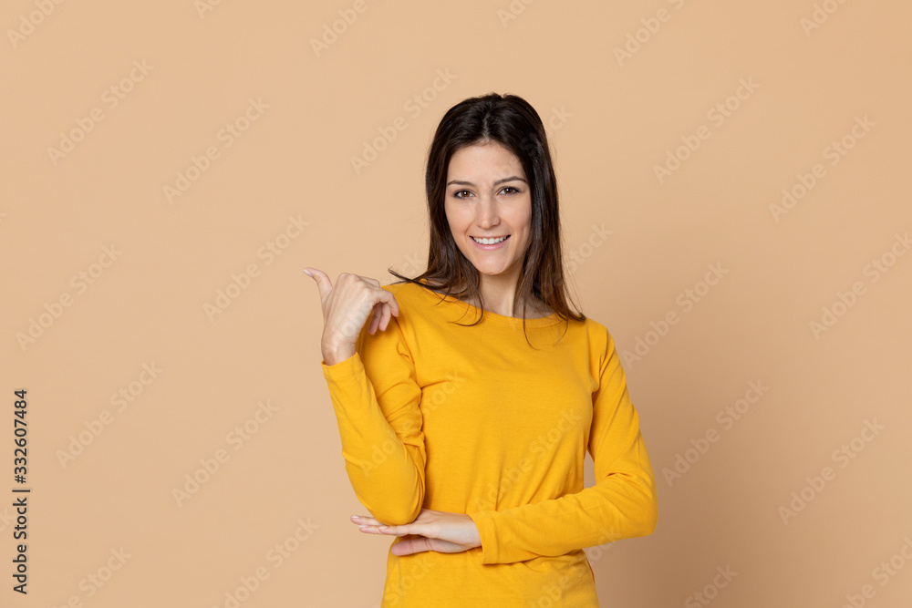 Attractive young girl wearing a yellow T-shirt Attractive young girl wearing a yellow T-shirt