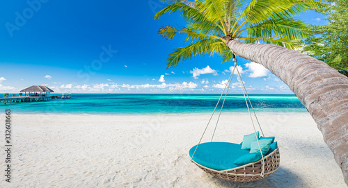 Tropical beach background as summer landscape with beach swing or hammock and white sand and calm sea for beach banner. Perfect beach scene vacation and summer holiday concept, luxury beach landscape © icemanphotos