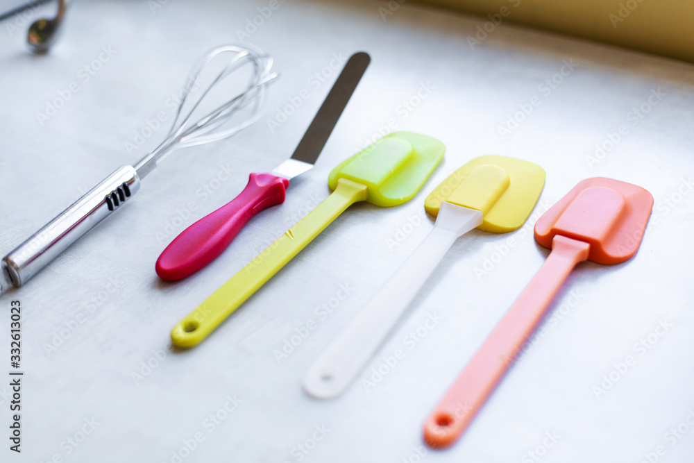 Set of multi-colored silicone spatulas, kitchen tools. Sweet pastries, recipes, cooking Set of multi-colored silicone spatulas, kitchen tools. Sweet pastries, recipes, cooking