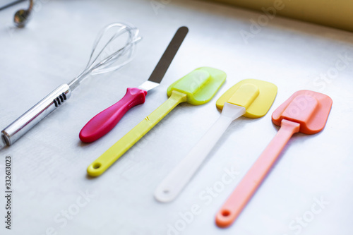 Set of multi-colored silicone spatulas, kitchen tools. Sweet pastries, recipes, cooking