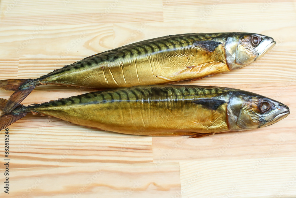 salted, smoked and dried fish, beer snacks, tasty fish on a wooden board salted, smoked and dried fish, beer snacks, tasty fish on a wooden board