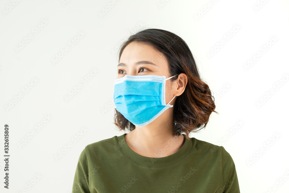 Woman wearing face mask because of Air pollution or virus epidemic in the city Woman wearing face mask because of Air pollution or virus epidemic in the city