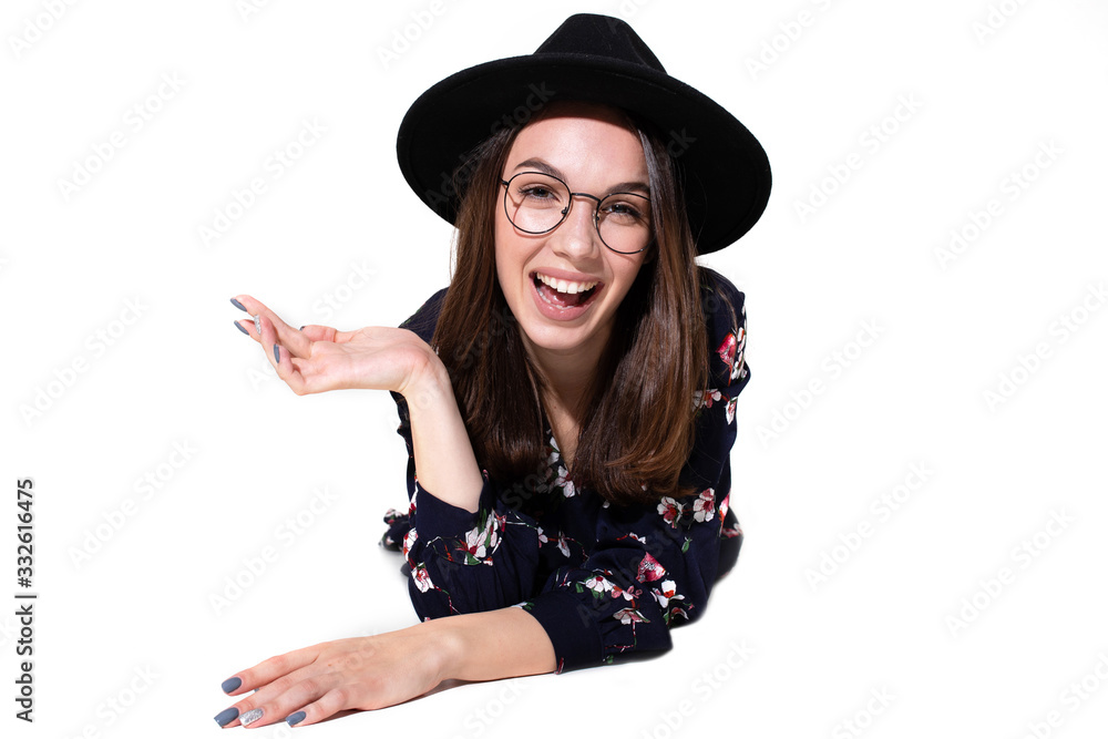Portrait of a beautiful girl in a hat who poses for the camera with emotions Portrait of a beautiful girl in a hat who poses for the camera with emotions