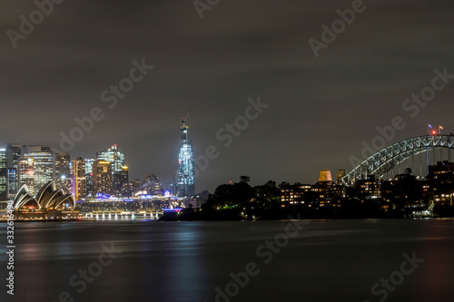 Sydney in Australia, taking pictures of the skyline with the Opera house during a cloudy but warm day in summer at night. © ms_pics_and_more