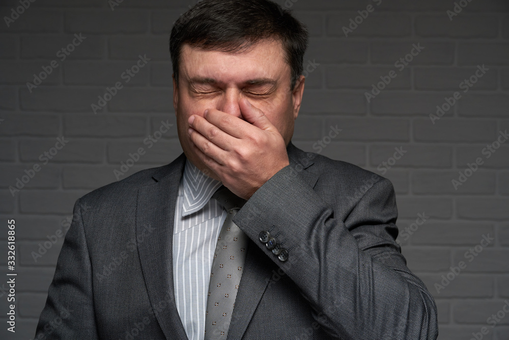 infected man sneezes or coughs and has symptoms of the disease - healthcare and medicine concept