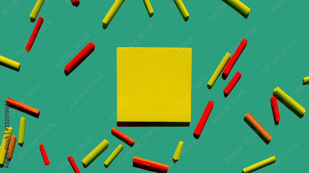 yellow post it papers and green background with some roll papers yellow post it papers and green background with some roll papers