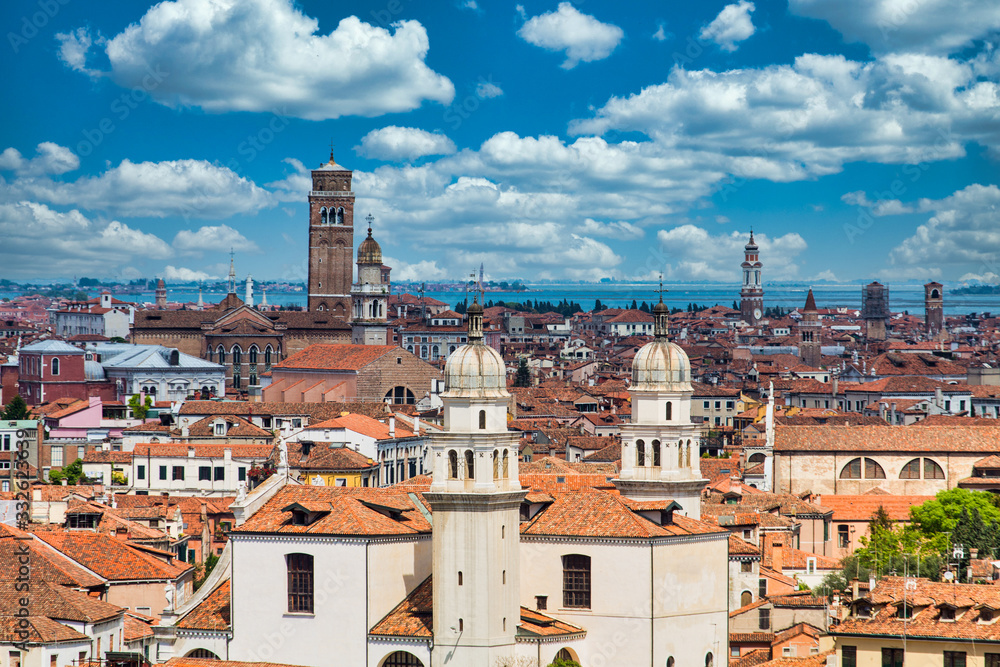 Tile rooftops and church domes across Venice skyline